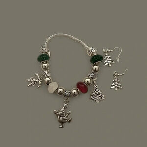 Homemade earrings and bracelet with red, green, white, silver beads  and…